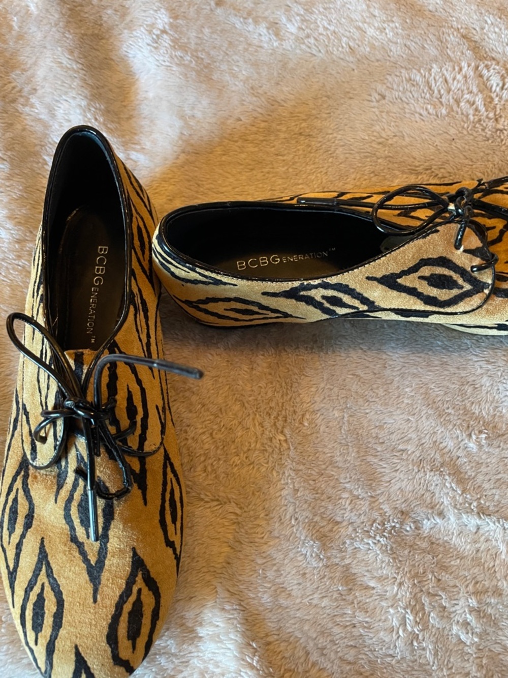 BCBGeneration Tan and Black Animal-Print Lace-Up Flats